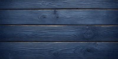 The primary subject of the image is a wooden wall with a blue tint. The setting is a room with a blue wooden wall, and the visual style is a close-up of the wooden wall. The colors and mood of the image are predominantly blue, creating a calm and serene atmosphere.