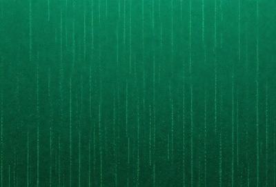 The primary subject of the image is a green wall with a pattern of lines on it. The setting is a room with a green wall, and the visual style appears to be a pattern or texture. The dominant colors are green and white, creating a calm and soothing atmosphere.