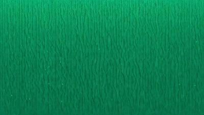The primary subject of the image is a green wall with a pattern of swirls and waves. The setting is a room with a green background, and the visual style appears to be a digital art or illustration. The dominant colors in the image are green and white, creating a calm and soothing atmosphere.