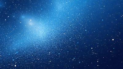 The primary subject of the image is a blue sky filled with stars. The setting is a night sky, and the visual style is a photo. The colors and mood of the image are predominantly blue and serene, creating a peaceful and tranquil atmosphere.