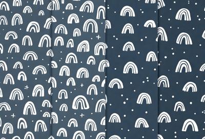 The primary subject of the image is a pattern of rainbow-colored arrows on a blue background. The setting is a wall, and the visual style is a combination of digital art and illustration. The colors and mood of the image are vibrant and lively, with the arrows and blue background creating a sense of movement and energy.