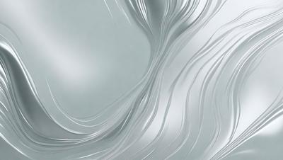 The primary subject of the image is a silver metal surface, which appears to be a metal wall or a metal sculpture. The setting is a room with a gray background, which contrasts with the silver metal surface. The visual style is a close-up of the metal surface, showcasing its texture and details. The colors and mood of the image are predominantly silver and gray, creating a modern and minimalist atmosphere.