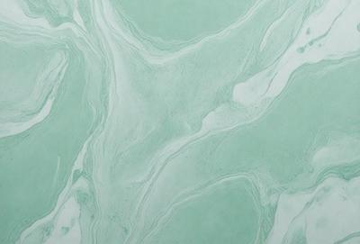 The primary subject of the image is a large, white, and green marble wall. The setting is a bathroom, with the marble wall serving as the main focal point. The visual style is a photo, capturing the intricate patterns and textures of the marble. The colors and mood of the image are predominantly white and green, creating a clean and soothing atmosphere.