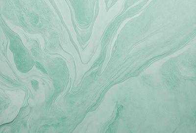 The primary subject of the image is a close-up of a green and white swirling pattern on a wall. The setting is a room with a white background, and the visual style appears to be a digital art or illustration. The dominant colors are green and white, creating a calming and soothing atmosphere.