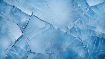 The primary subject of the image is a large, blue, frozen surface with numerous cracks and fissures. The setting is a cold, icy environment, and the visual style is a close-up of the frozen surface. The dominant colors are blue and white, creating a chilly and frozen atmosphere.