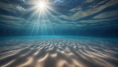 The primary subject of the image is a sunlight shining through the water, creating a beautiful and serene scene. The setting is underwater, with the sunlight illuminating the water and creating a stunning visual effect. The visual style of the image is a photo, capturing the natural beauty of the underwater environment. The colors and mood of the image are predominantly blue and calming, as the sunlight creates a peaceful atmosphere in the underwater world.