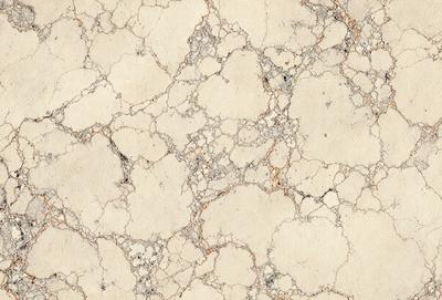 The image features a white marble wall with a pattern of holes and bumps. The wall appears to be textured and has a unique design. The primary subject of the image is the marble wall, which serves as the main focus of the scene. The setting is indoors, likely in a building or a room with a distinctive architectural feature. The visual style of the image is a close-up of the marble wall, showcasing its intricate details. The colors and mood of the image are predomin