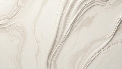 The primary subject of the image is a white marble wall with a pattern of swirls and waves. The setting is a room with a white marble floor, which complements the wall. The visual style is a close-up of the marble wall, showcasing its intricate design. The colors and mood of the image are predominantly white, giving it a clean and elegant appearance.