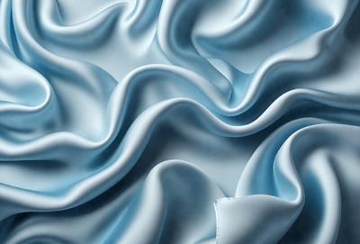 The primary subject of the image is a close-up of a blue fabric, possibly a piece of cloth or a curtain. The setting is a room with a blue background, which adds to the overall atmosphere. The visual style is a combination of a photo and a digital art, creating a unique and intricate pattern. The colors and mood of the image are predominantly blue, giving it a calm and serene appearance.