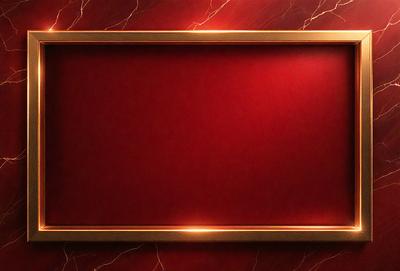 The primary subject of the image is a red frame with a red background. The setting is a marble wall, and the visual style appears to be a photo. The dominant colors are red, and the overall atmosphere is bold and striking.