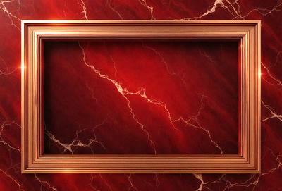 The primary subject of the image is a red marble frame. The setting is a red marble wall, which serves as the background. The visual style is a close-up of the marble frame, showcasing its texture and color. The dominant colors are red and maroon, creating a warm and luxurious atmosphere.