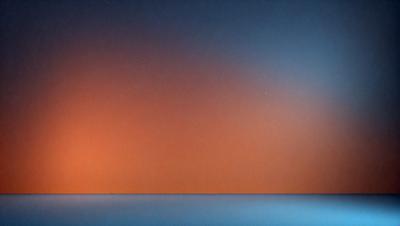 The primary subject of the image is a wall with a blue and orange color scheme. The setting is a room with a blue wall, and the visual style appears to be a photo. The dominant colors are blue and orange, creating a warm and inviting atmosphere.