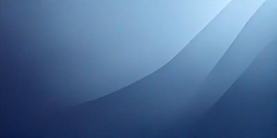 The primary subject of the image is a blue wall with a curved design. The setting is a room with a blue background, and the visual style appears to be a photo. The dominant colors in the image are blue and white, creating a calm and serene atmosphere.