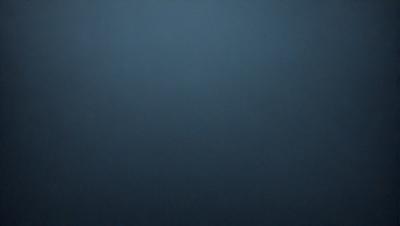 The primary subject of the image is a blue sky with no clouds. The setting is a dark blue background, which creates a contrast with the sky. The visual style is a simple, clean, and minimalistic representation of the sky. The colors and mood of the image are predominantly dark and moody, with the blue sky being the main focus.
