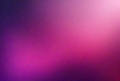 The primary subject of the image is a pink background. The setting is a purple background, which creates a contrasting and visually appealing effect. The visual style of the image is a close-up of the pink background, emphasizing its vibrant color. The colors and mood of the image are predominantly pink and purple, giving it a warm and inviting atmosphere.