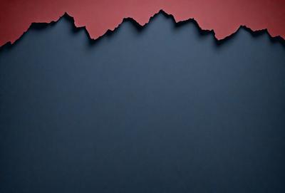 The primary subject of the image is a piece of red and blue paper. The setting is a dark blue background, which contrasts with the red and blue paper. The visual style appears to be a digital art or illustration, as the paper is cut into the shape of a mountain. The colors and mood of the image are dominated by the red and blue hues, creating a vibrant and lively atmosphere.