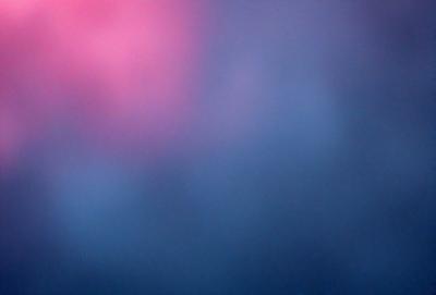 The primary subject of the image is a purple and blue sky. The setting is a cloudy sky, with the clouds being the main backdrop. The visual style is a photo, capturing the natural beauty of the sky. The colors and mood of the image are predominantly purple and blue, creating a serene and calming atmosphere.