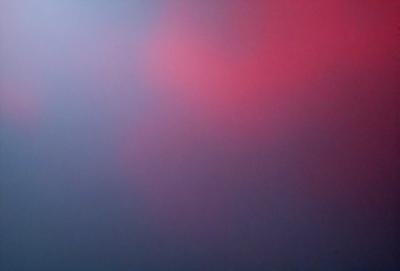 The primary subject of the image is a red and blue background, which creates a vibrant and lively atmosphere. The setting is a foggy, cloudy sky, which adds a sense of depth and mystery to the scene. The visual style is a combination of digital art and illustration, giving the image a unique and artistic appearance. The dominant colors are red and blue, which create a bold and striking contrast against the foggy sky.