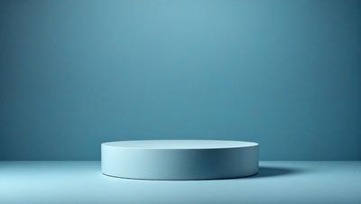 The primary subject of the image is a white, round, flat object, which appears to be a table or a piece of art. The setting is a blue background, which creates a contrasting and visually appealing environment. The visual style of the image is a photo, showcasing the object in its natural surroundings. The colors and mood of the image are predominantly blue, giving it a calm and serene atmosphere.