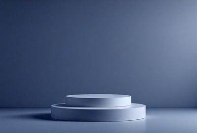 The primary subject of the image is a white, circular object, which appears to be a white plate or a white bowl. The setting is a blue background, which creates a contrasting and visually appealing scene. The visual style of the image is a photo, showcasing the white plate or bowl in a clear and detailed manner. The colors and mood of the image are predominantly blue, giving it a calm and serene atmosphere.