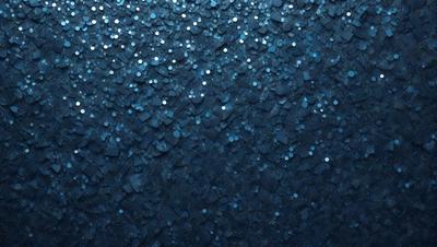 The primary subject of the image is a blue background with a pattern of black circles. The setting appears to be a night sky, creating a sense of depth and contrast. The visual style is a combination of a photo and digital art, as the black circles have a slightly digital appearance. The colors and mood of the image are predominantly dark and moody, with the blue background providing a sense of calmness.