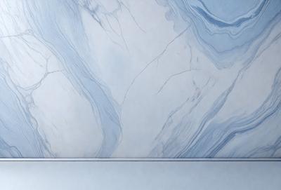 The primary subject of the image is a marble-like wall with a blue and white color scheme. The setting is a bathroom, and the visual style is a photo. The colors and mood of the image are calming and elegant, with the blue and white tones creating a serene atmosphere.