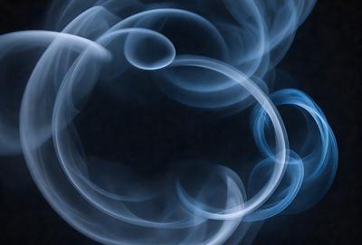 The primary subject of the image is a blue smoke ring, which is the main object, scene, or focus of the image. The setting is a dark background, which creates a dramatic contrast with the smoke ring. The visual style is a digital art or illustration, as the smoke ring is depicted in a detailed and artistic manner. The colors and mood of the image are predominantly blue, giving it a calm and serene atmosphere.