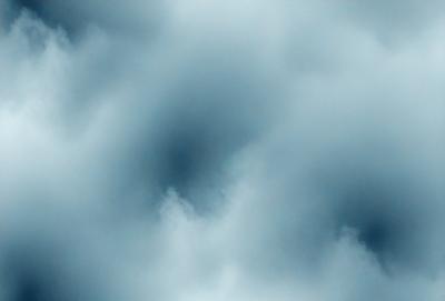 The primary subject of the image is a cloudy sky. The setting is a blue cloudy sky with a few clouds scattered throughout. The visual style is a photo of the cloudy sky. The colors and mood of the image are predominantly blue, with a slightly gloomy atmosphere.