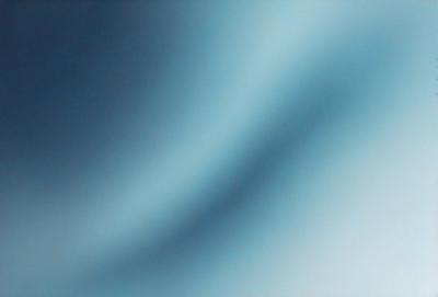 The primary subject of the image is a blue sky with a few clouds. The setting is a clear day with a blue sky as the backdrop. The visual style is a photo of the sky, showcasing the beauty of the natural environment. The colors and mood of the image are predominantly blue, creating a calm and serene atmosphere.