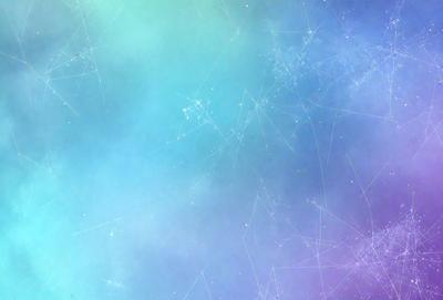 The primary subject of the image is a blue and purple background with a pattern of stars. The setting is a space-like environment, and the visual style appears to be a digital art or illustration. The dominant colors are blue and purple, creating a calm and serene atmosphere.