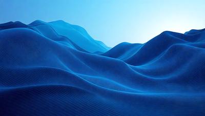 The primary subject of the image is a blue ocean with waves. The setting is a vast expanse of water, and the visual style is a photo. The dominant colors are blue and white, creating a serene and calming atmosphere.