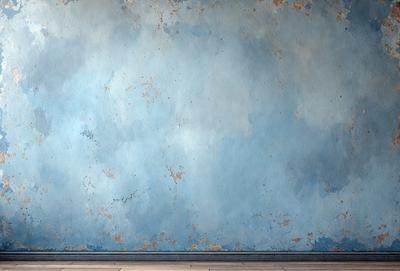 The primary subject of the image is a blue wall with a cloudy pattern. The setting is a room with a blue wall, and the visual style is a photo. The dominant colors are blue and white, creating a calm and serene atmosphere.