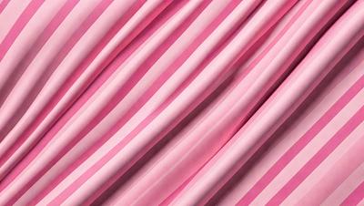 The primary subject of the image is a pink and white striped fabric. The setting is a close-up of the fabric, showcasing its pattern and texture. The visual style is a detailed, up-close view of the fabric. The colors and mood of the image are predominantly pink and white, creating a soft and elegant atmosphere.