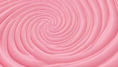 The primary subject of the image is a large, pink, spiral-shaped object. The setting is a pink background, which creates a visually striking contrast with the spiral. The visual style appears to be a combination of a photo and a digital art or illustration, as the spiral is depicted in a detailed and intricate manner. The colors and mood of the image are predominantly pink, giving it a warm and inviting atmosphere.