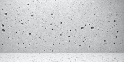 The primary subject of the image is a wall with a pattern of holes in it. The setting is a white wall, and the visual style appears to be a photo. The dominant colors are white and grey, creating a clean and minimalist atmosphere.