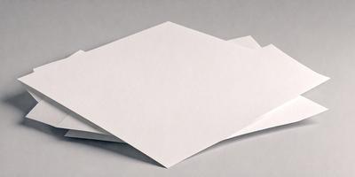 The primary subject of the image is a stack of white paper. The setting is a table, and the visual style is a photo. The colors and mood of the image are predominantly white, giving it a clean and simple appearance.