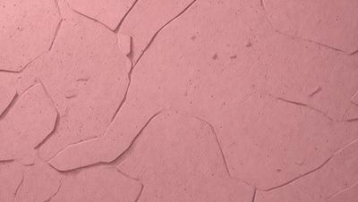 The primary subject of the image is a pink surface, which appears to be a piece of paper or a wall. The setting is a room with a pink background, and the visual style is a close-up of the pink surface. The colors and mood of the image are predominantly pink, creating a warm and inviting atmosphere.