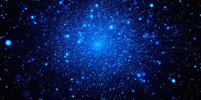 The primary subject of the image is a cluster of stars in the night sky. The setting is a dark, star-filled sky, and the visual style is a photo of the night sky. The colors and mood of the image are predominantly dark and serene, with the stars being the main focus and source of light.