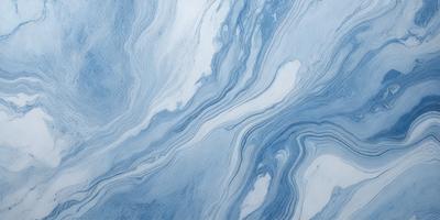 The primary subject of the image is a blue and white ocean wave. The setting is the ocean, with the wave crashing against the surface. The visual style is a photo of the ocean, capturing the beauty and power of the wave. The dominant colors are blue and white, creating a serene and calming atmosphere.