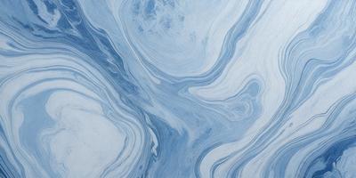 The primary subject of the image is a blue and white ocean wave. The setting is the ocean, with the wave crashing on the surface. The visual style is a photo of the ocean, capturing the beauty and power of the waves. The dominant colors are blue and white, creating a serene and calming atmosphere.