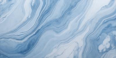 The primary subject of the image is a blue and white marble tile. The setting is a bathroom, as indicated by the presence of the marble tile. The visual style is a close-up of the tile, showcasing its intricate design. The dominant colors are blue and white, creating a clean and elegant atmosphere.
