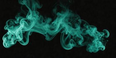 The primary subject of the image is a blue smoke or mist, which is the main focus of the scene. The setting is a dark background, which contrasts with the blue smoke. The visual style of the image is a digital art or illustration, as it appears to be a computer-generated or digitally manipulated image. The dominant colors in the image are blue and green, creating a calm and serene atmosphere.