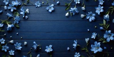 The primary subject of the image is a blue wall with white flowers arranged on it. The setting is a room with a blue background, and the visual style is a photo. The dominant colors are blue and white, creating a calm and serene atmosphere.