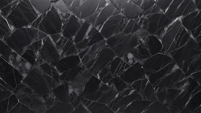 The primary subject of the image is a black marble countertop with a patterned design. The setting is a kitchen, and the visual style is a close-up of the marble countertop. The colors and mood of the image are predominantly black, giving it a sleek and modern appearance.