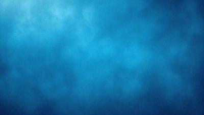 The primary subject of the image is a blue sky with clouds. The setting is a cloudy day, and the visual style is a photo. The dominant colors are blue and white, creating a calm and serene atmosphere.