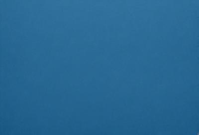The primary subject of the image is a large, open, and dark blue sky. The setting is a vast, empty space with no visible landmarks or objects. The visual style is a natural, untouched, and unaltered representation of the sky. The colors and mood convey a sense of tranquility and vastness.