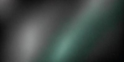 The primary subject of the image is a green background, which appears to be a painting or a drawing. The setting is a dark room, and the visual style is artistic. The colors and mood of the image are predominantly green, creating a calm and serene atmosphere.