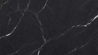 The primary subject of the image is a black marble countertop. The setting is a kitchen, with the countertop being the main focus of the scene. The visual style is a close-up of the marble countertop, showcasing its texture and pattern. The colors and mood of the image are predominantly dark, with the black marble countertop being the main source of contrast.