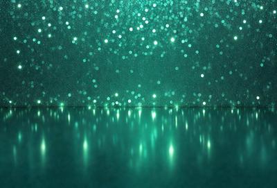The primary subject of the image is a green background with a pattern of lights. The setting appears to be a dark room with a green tint, creating a unique and visually striking atmosphere. The visual style of the image is a combination of digital art and illustration, with the lights creating a dynamic and engaging pattern. The colors and mood of the image are predominantly green, giving it a calm and serene feel.