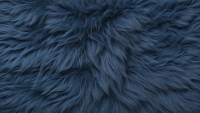 The primary subject of the image is a blue, furry, and fuzzy object, which appears to be a piece of fabric or a rug. The setting is a blue background, which complements the blue color of the object. The visual style is a close-up of the blue fabric, showcasing its texture and details. The colors and mood of the image are predominantly blue, creating a calm and soothing atmosphere.